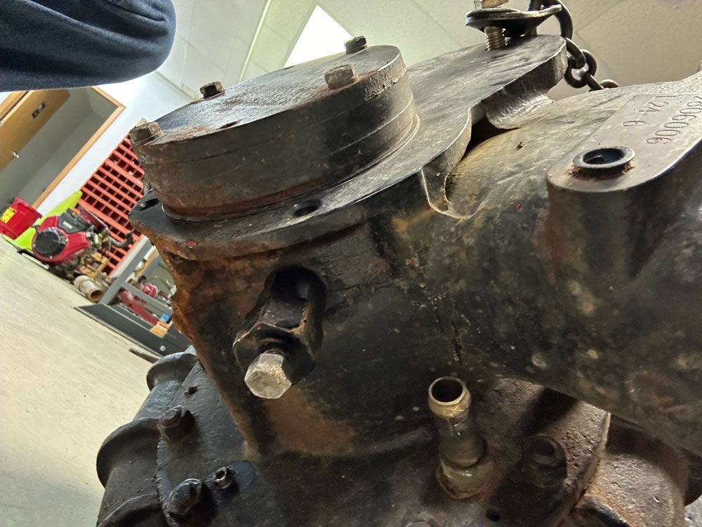 The large nut with the bolt going through it is a Darley packing nut and tube that pushes the injection pellet into the “stuffing box.”